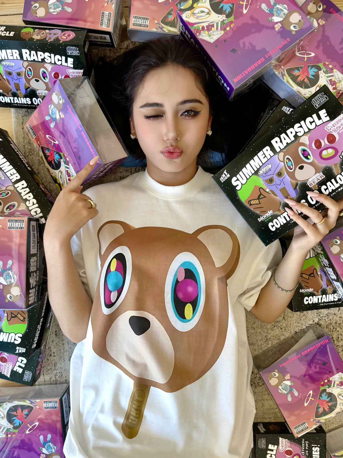 Model wearing the white Dropout Bear Summer Rapsicle T-Shirt
